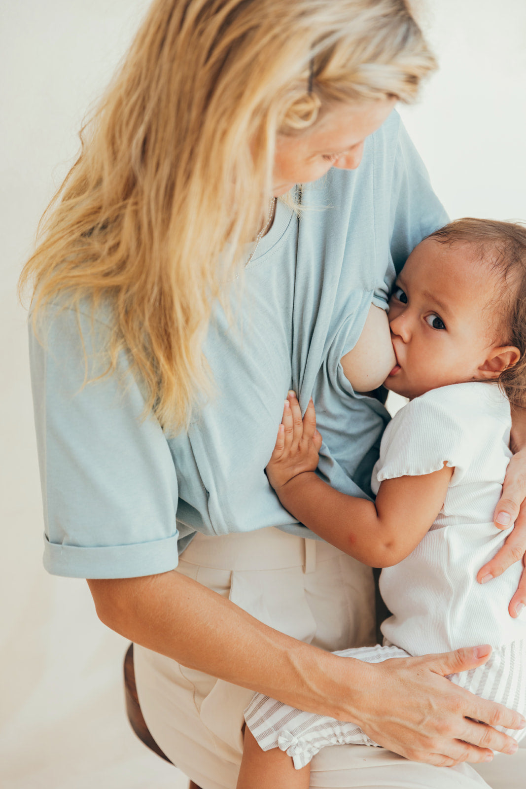 Sea-green #MOMMY nursing T-shirt worn by a mom with her baby