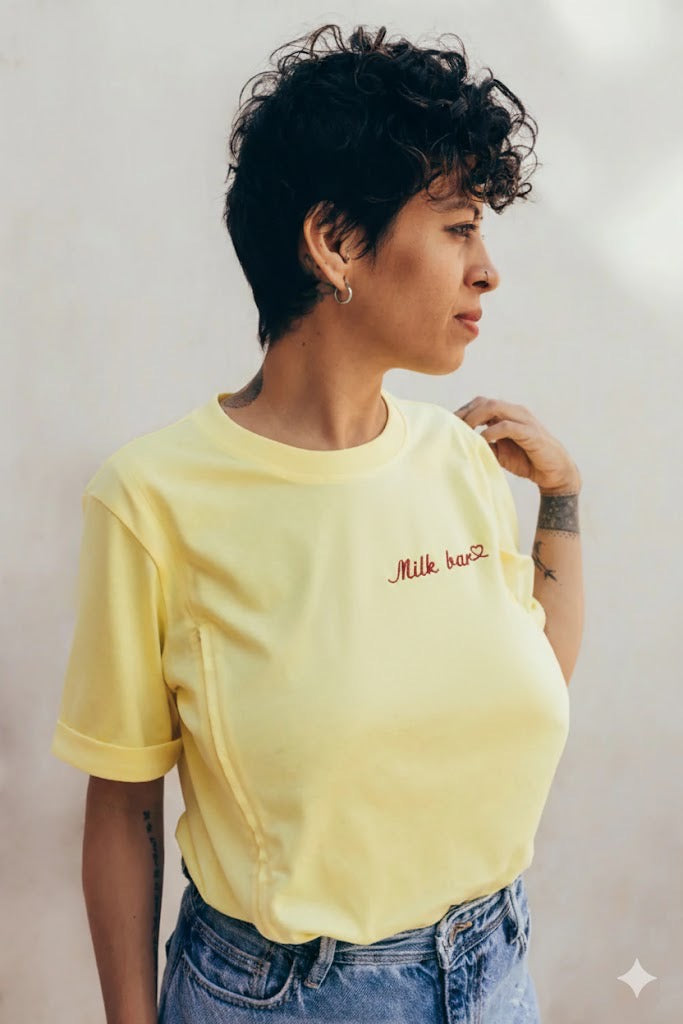 Photo of a woman wearing a yellow nursing top