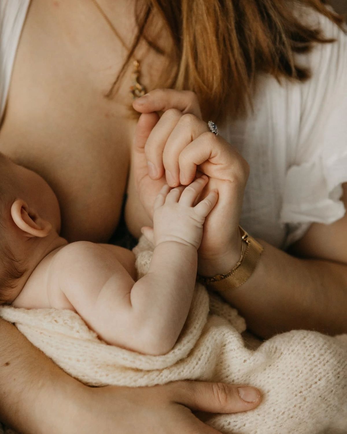 a mother breastfeeding her child 