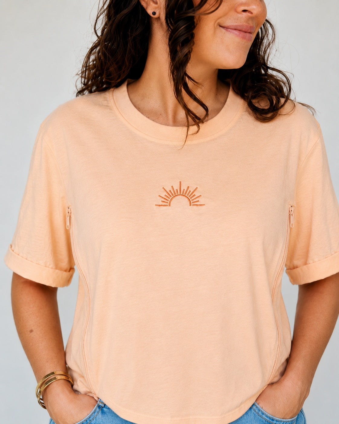 Tangerine-colored nursing T-shirt with embroidered sun